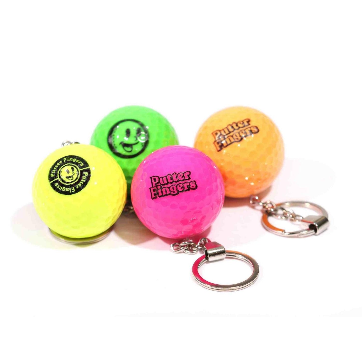 Four mini golf ball keyrings in yellow, green, pink, and orange colors, each featuring the Putterfingers logo branding on them